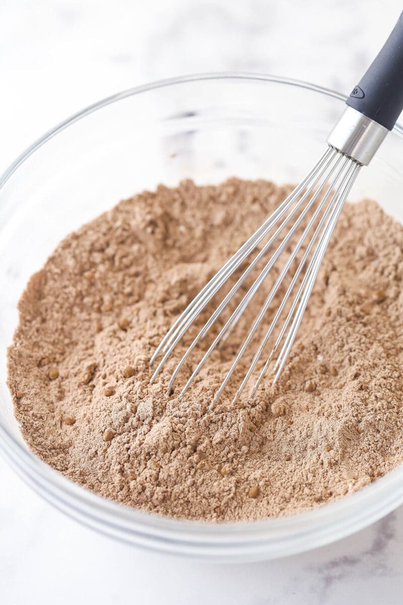 Whisking together dry ingredients for brownie cookies.