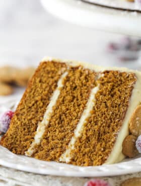 A slice of gingerbread layer cake on a plate.