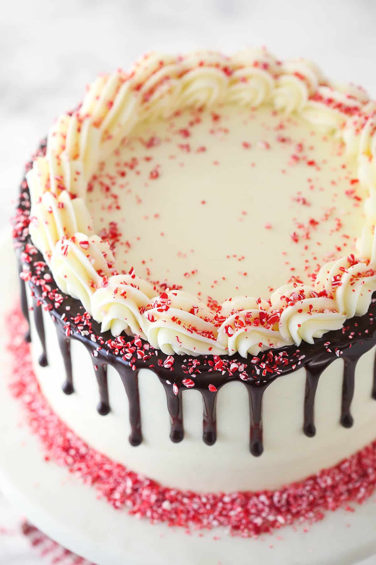 Overhead image of chocolate peppermint layer cake on a cake stand.