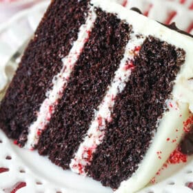 A slice of chocolate peppermint layer cake on a plate.