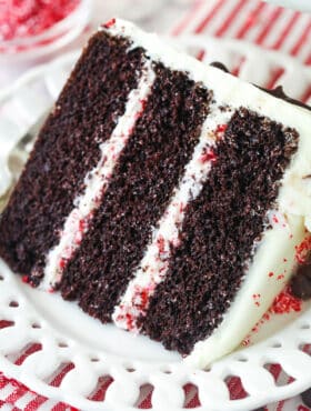 A slice of chocolate peppermint layer cake on a plate.