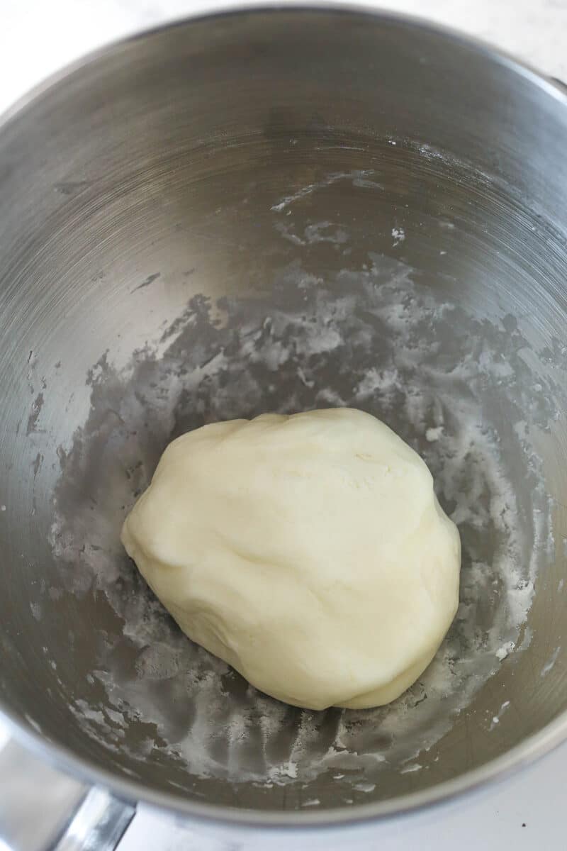 Peppermint fondant filling gathered into a ball in a mixing bowl.