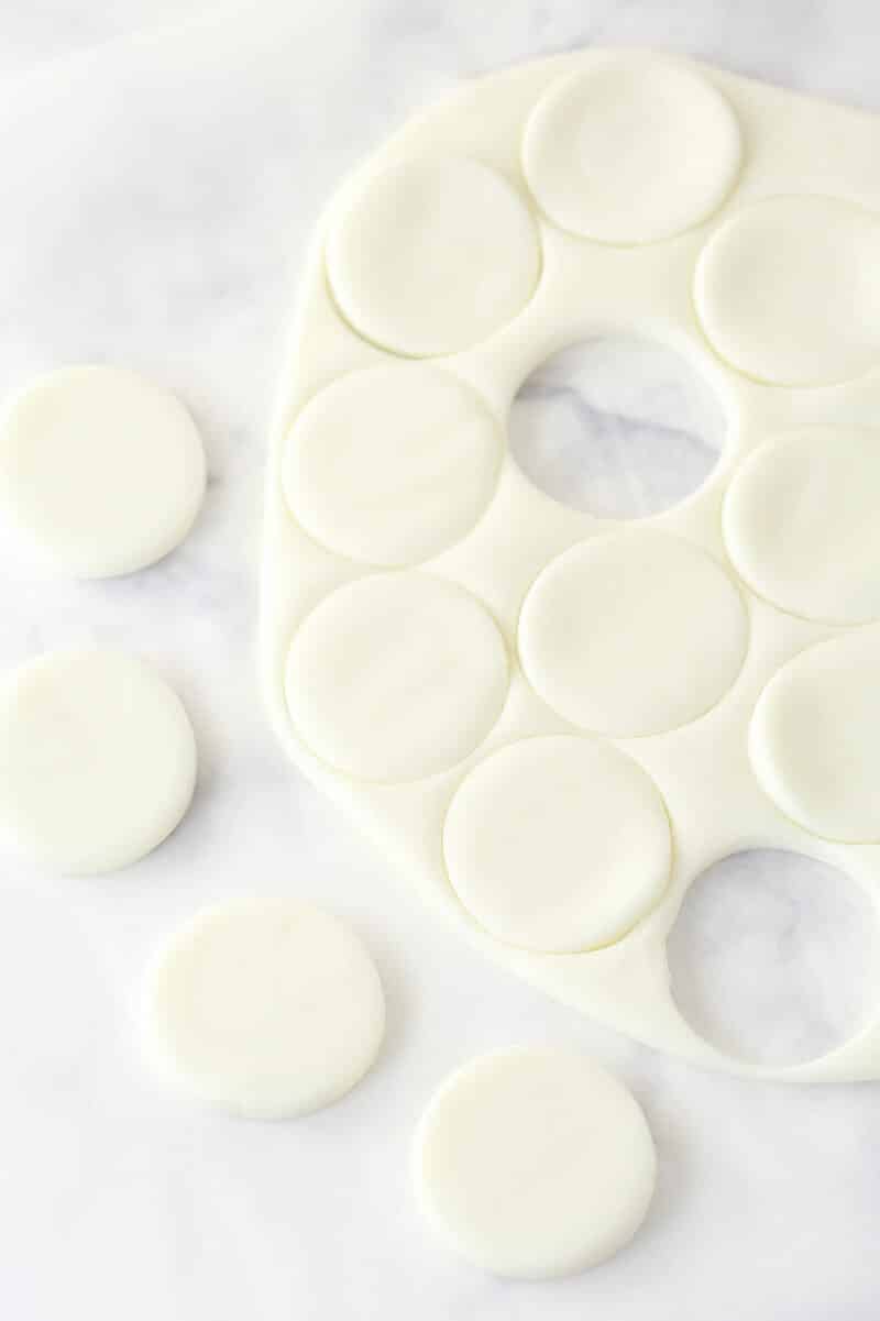 Cutting peppermint fondant into patties.