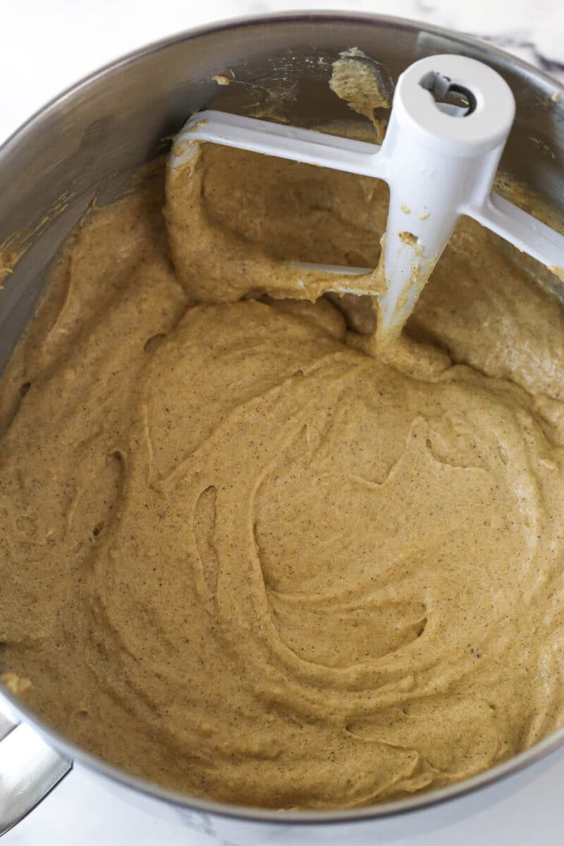 Batter for Spice Cake in a large metal mixing bowl after the dry ingredients have been added.