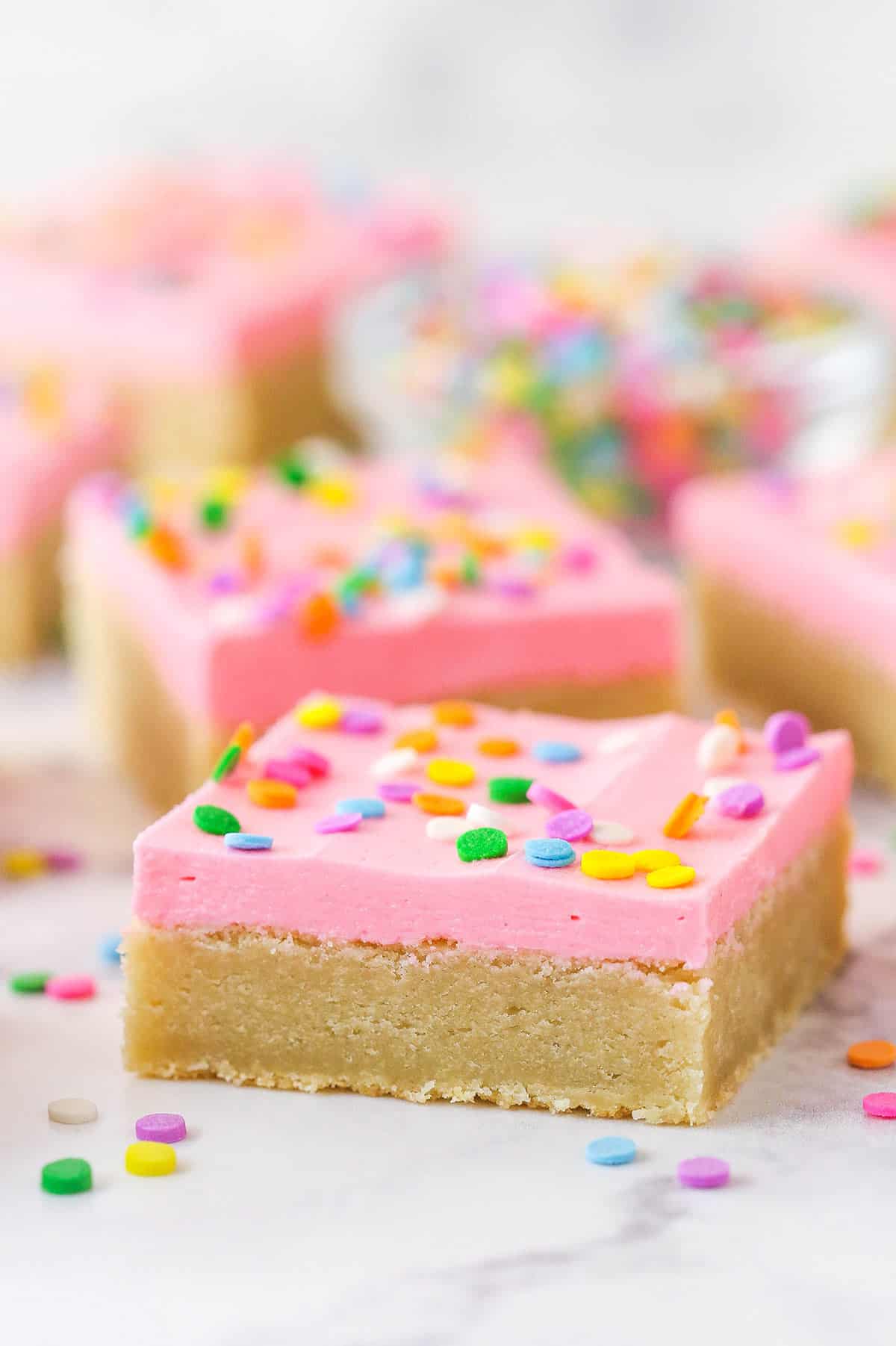 Sugar cookie bars on a marble countertop.