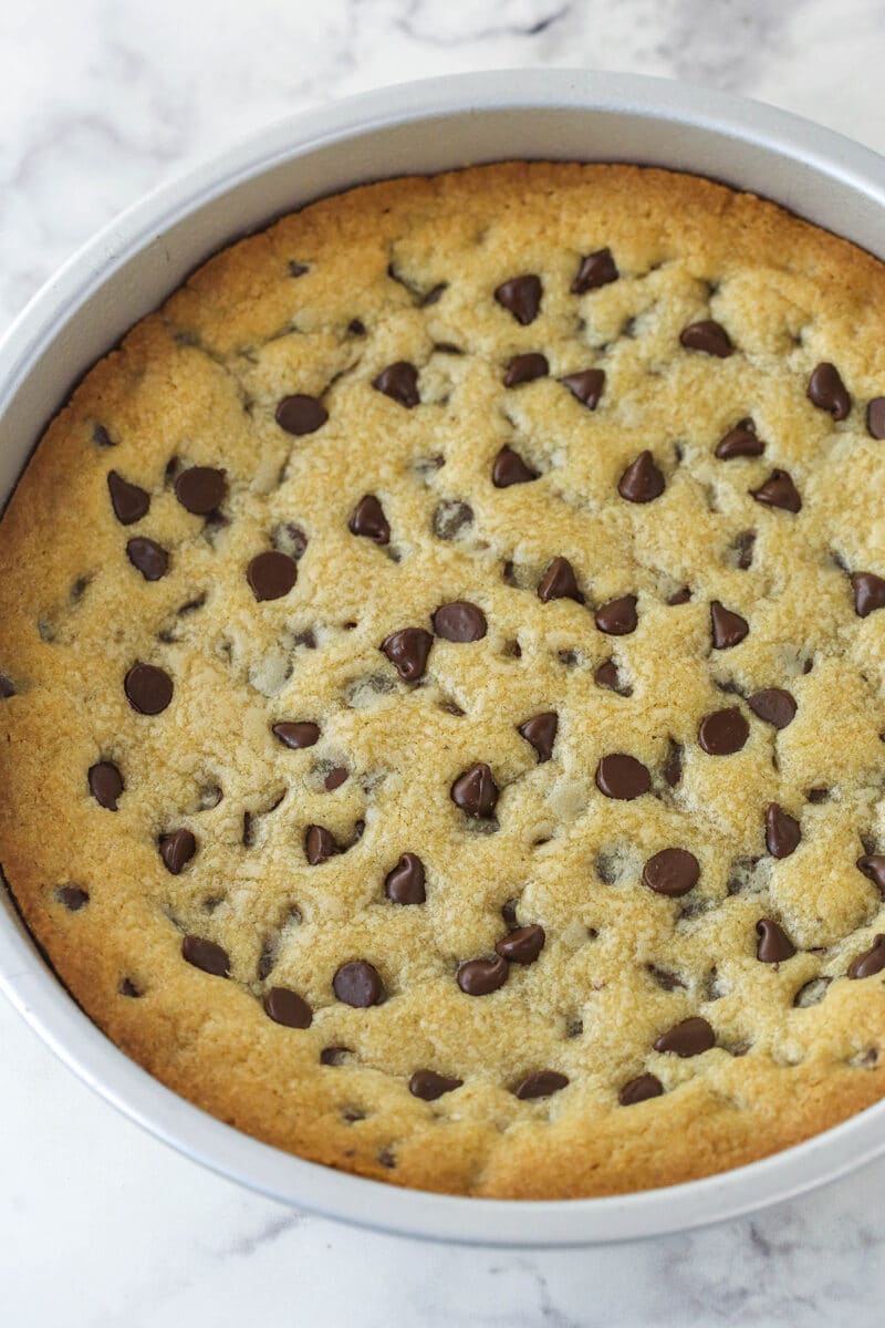 Chocolate chip cookie cake cooling in the pan.
