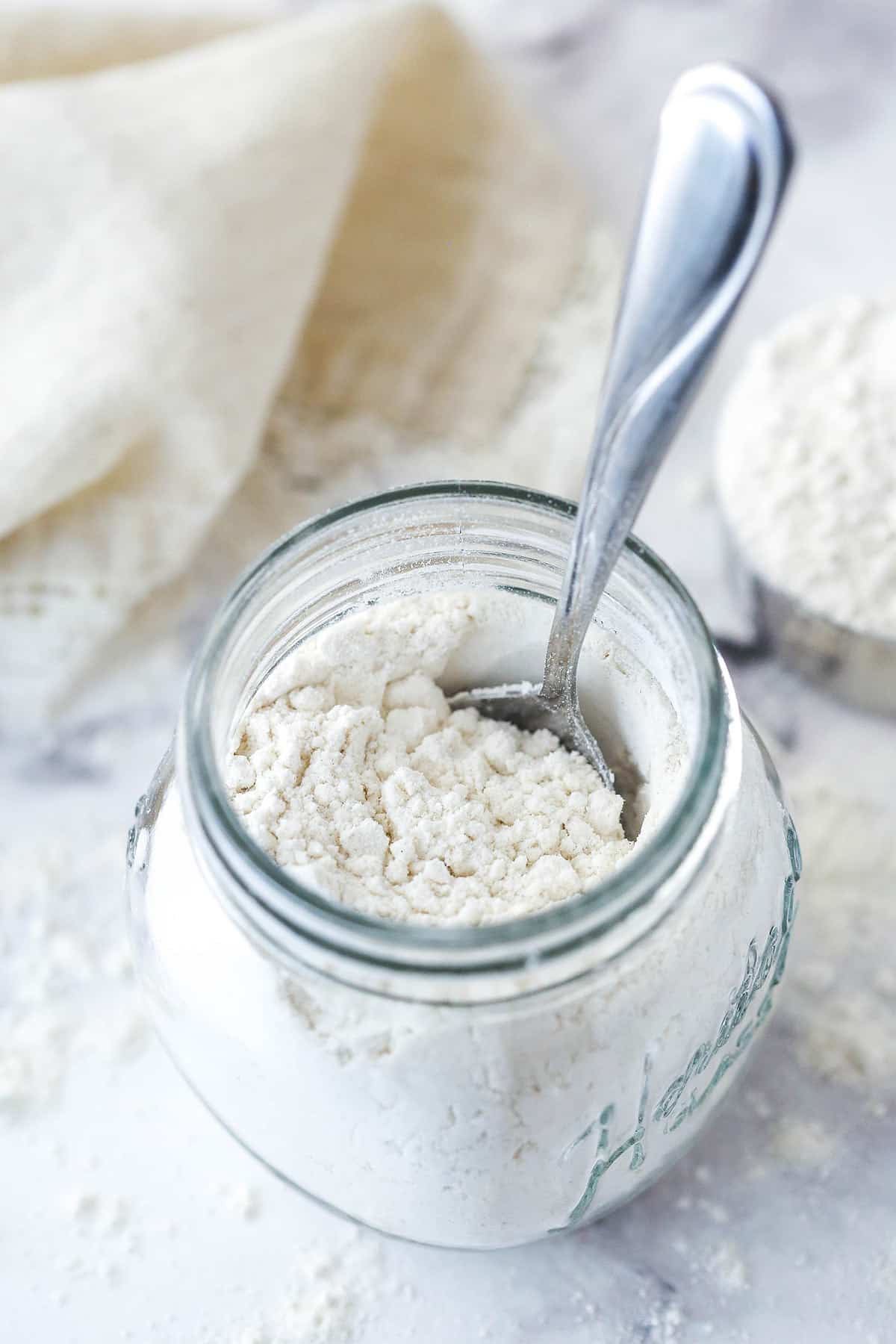 A spoon in a jar or heat treated flour.