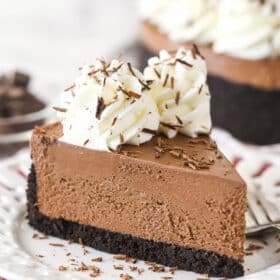 A slice of No-Bake Chocolate Cheesecake on a small white plate.