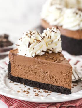 A slice of No-Bake Chocolate Cheesecake on a small white plate.