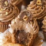 Nutella cupcakes on a serving platter. One has a bite taken out of it.