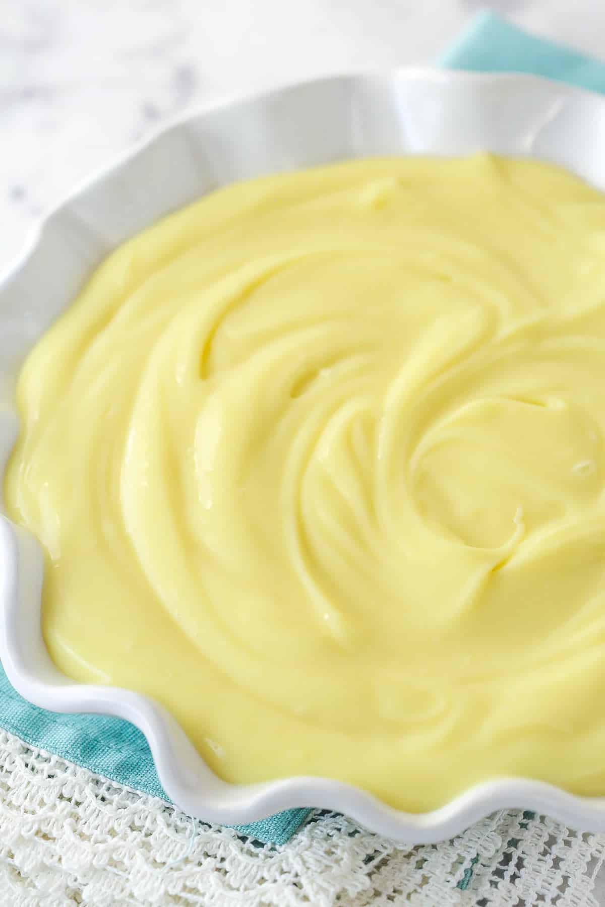 This recipe will get you velvety smooth, just-the-right-amount-of-sweet pastry cream every time. A perfect addition to any dessert. Pastry cream in a serving bowl.