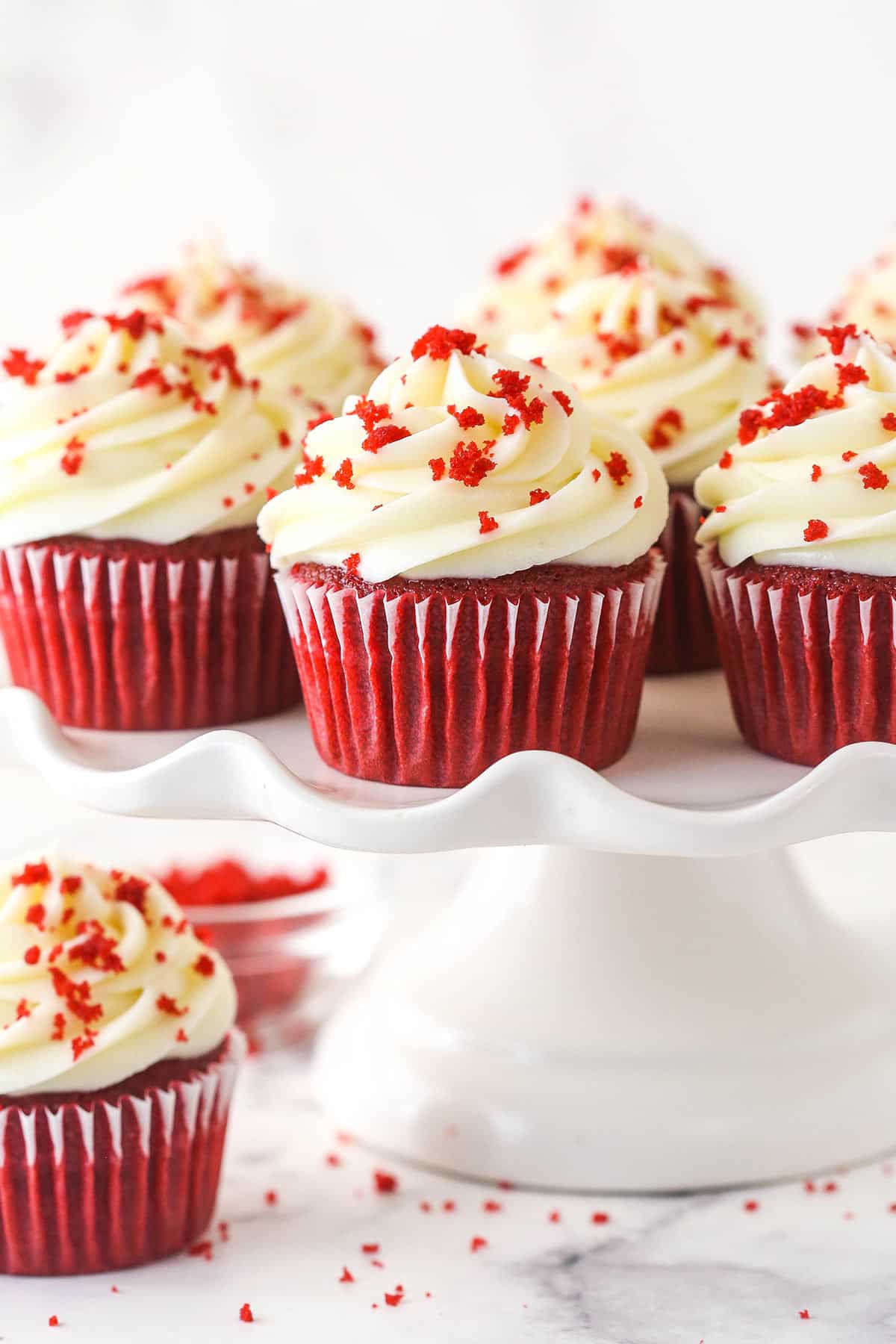 Red velvet cupcakes on a cake stand.