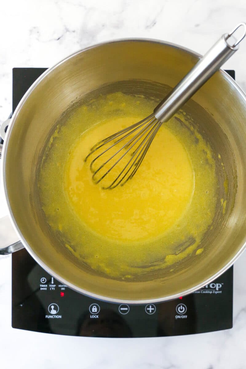 Egg yolk mixture during whisking for Strawberry Champagne Tiramisu filling.