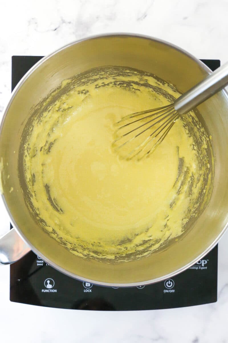 Egg yolk mixture for Strawberry Champagne Tiramisu during whisking process.