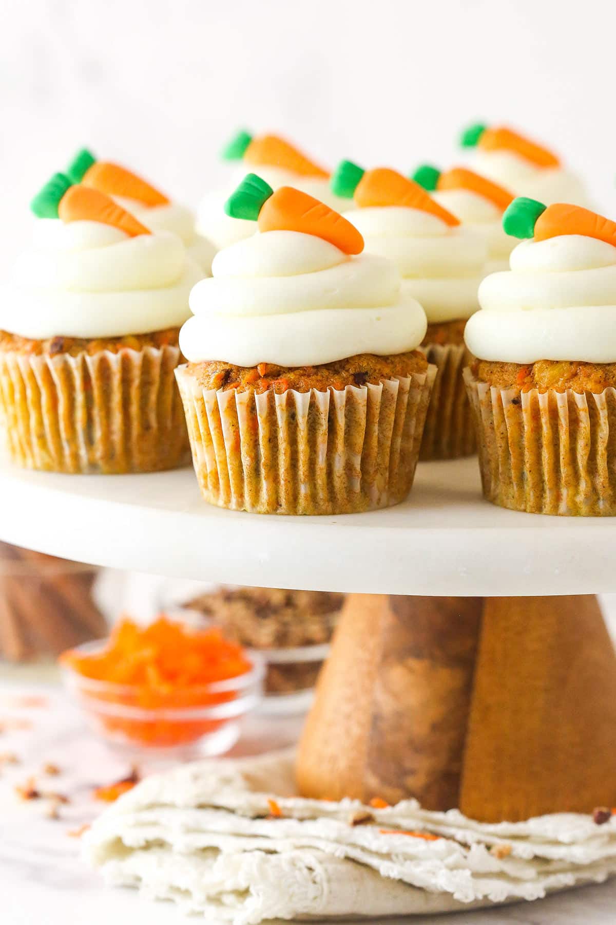 Carrot cake cupcakes on a cake stand.