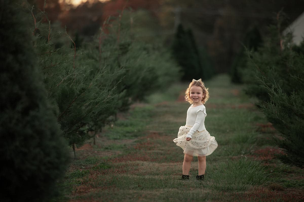 McKenzie twirling dress in trees