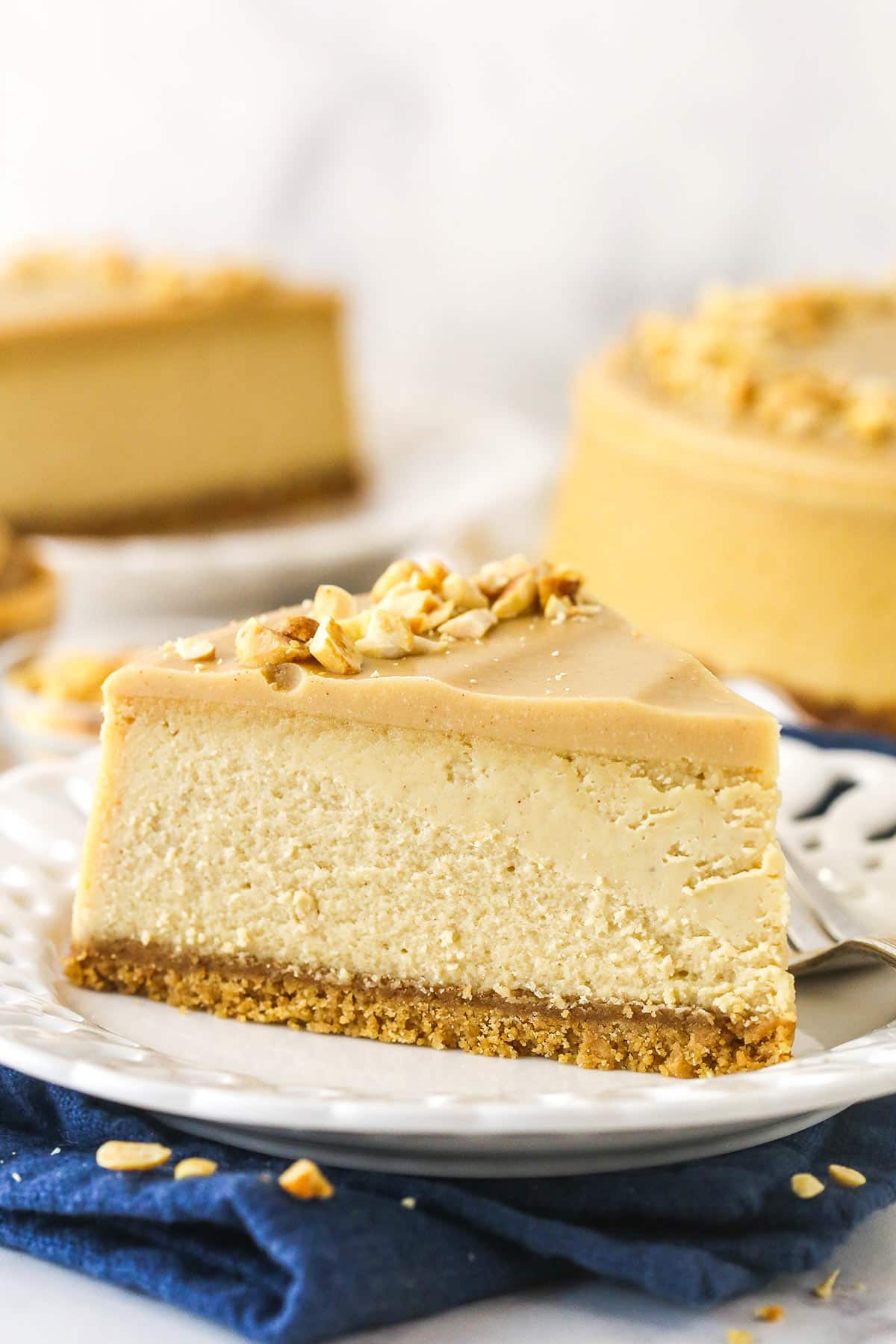 A slice of peanut butter cheesecake on a plate.