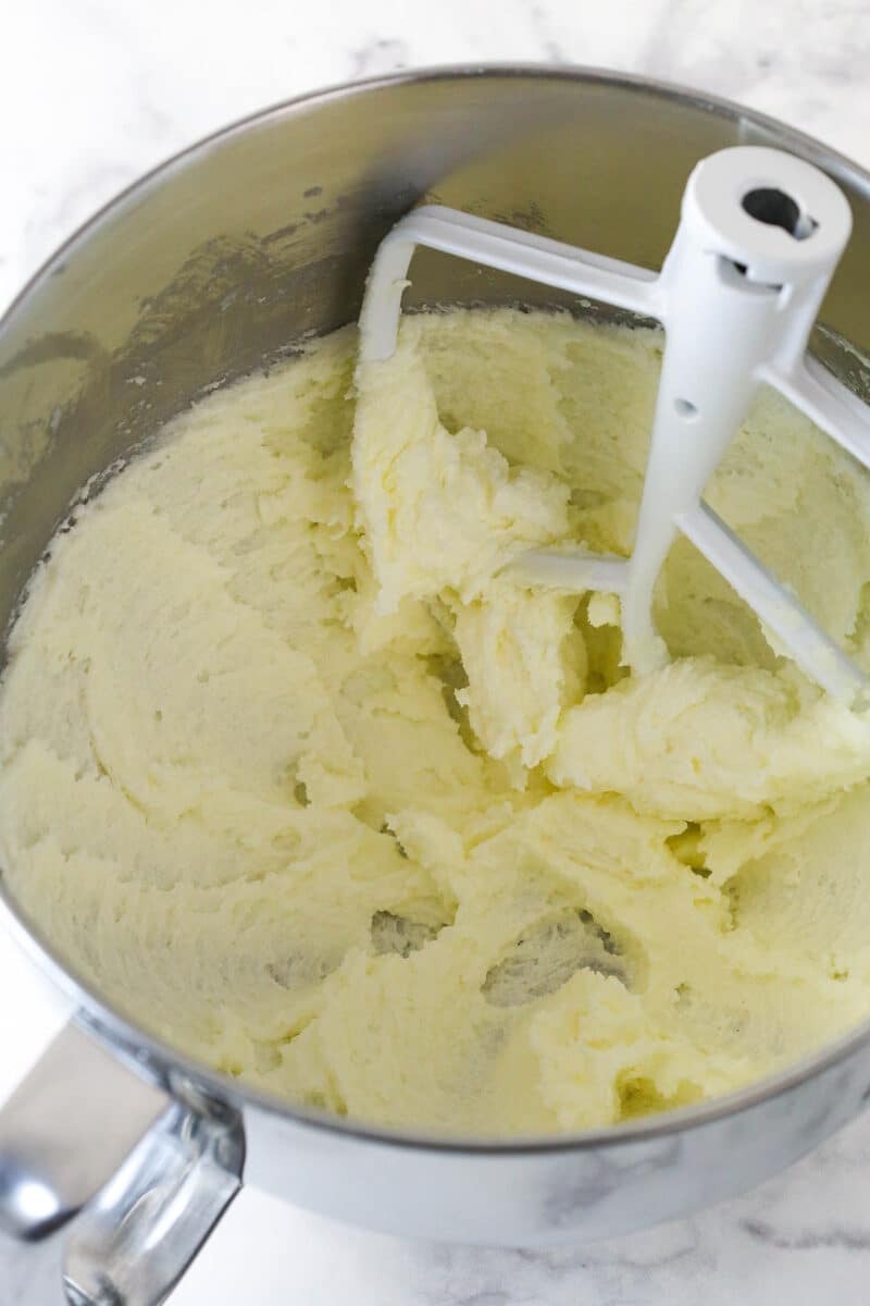 Creaming together butter and sugar to make cookie dough.