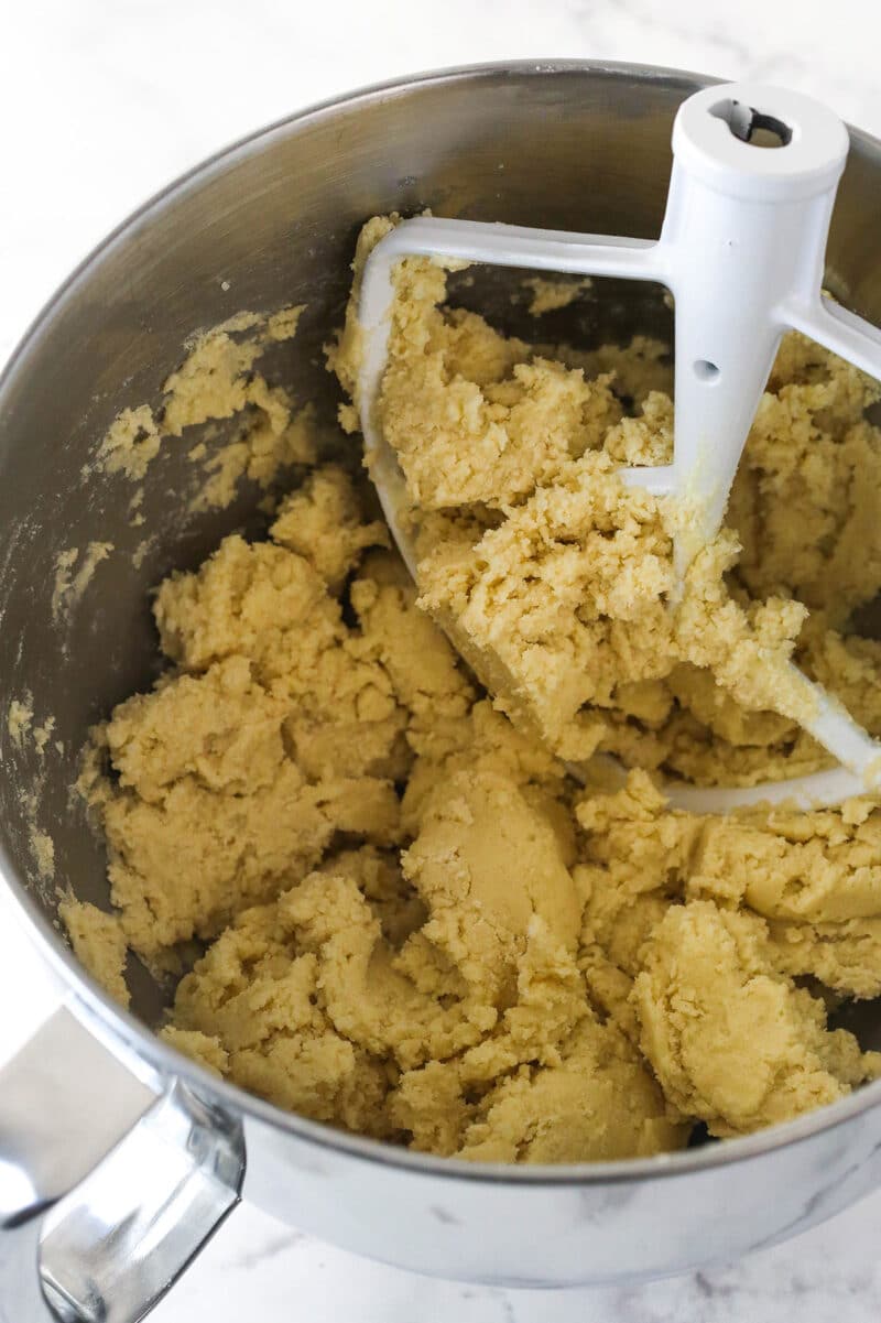 Combining the wet and dry ingredients for cookie dough.