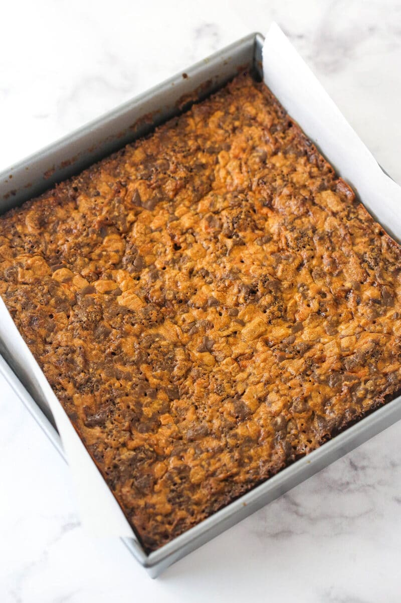 Butterfinger brownies cooling in a baking pan.