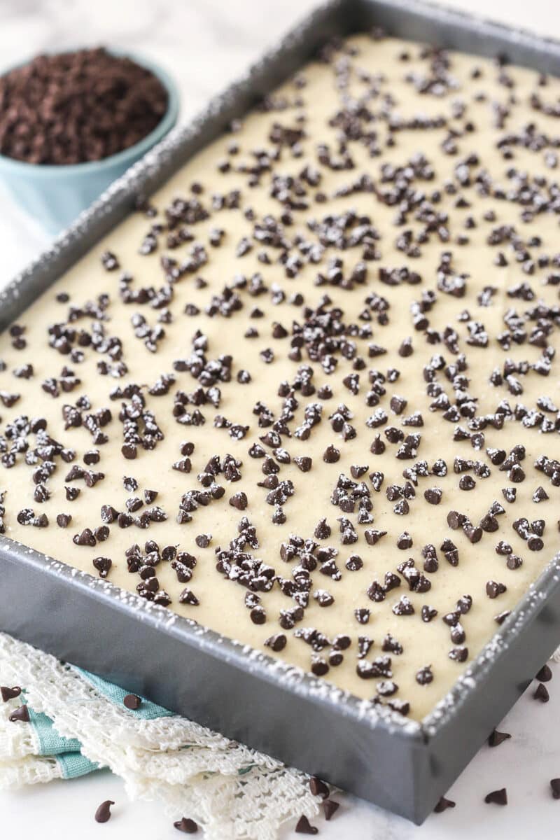 Cannoli poke cake in a baking pan.