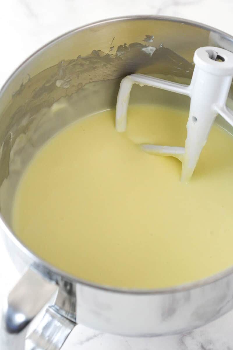 Stirring eggs into cheesecake batter.