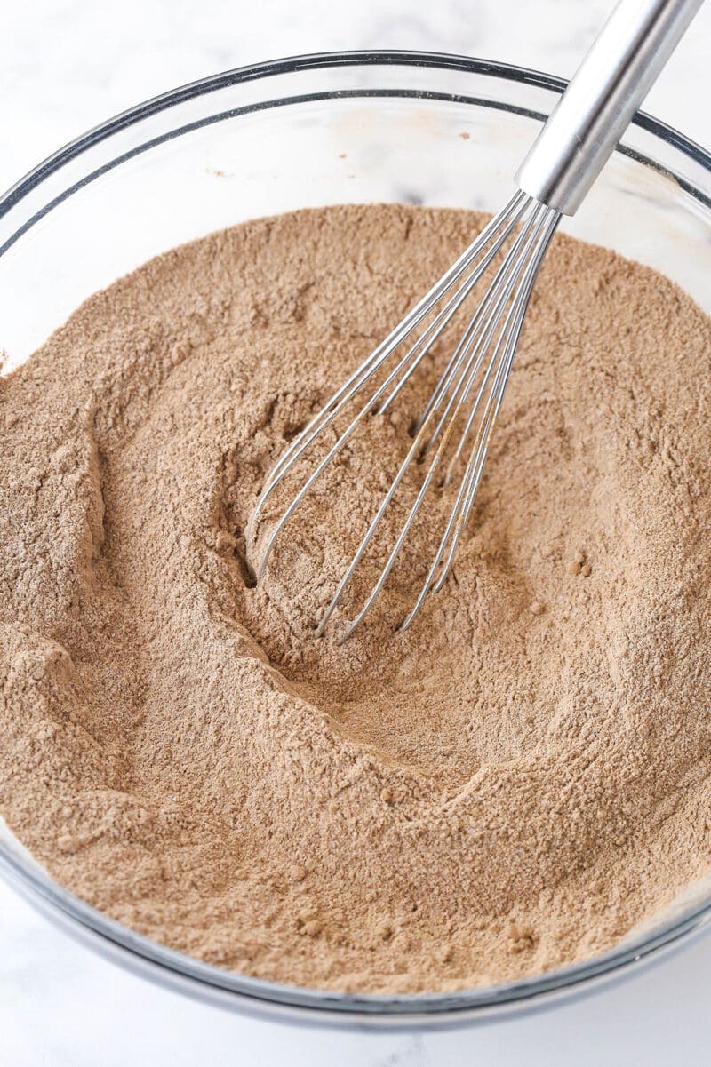 Whisking together the dry ingredients for chocolate cake batter.