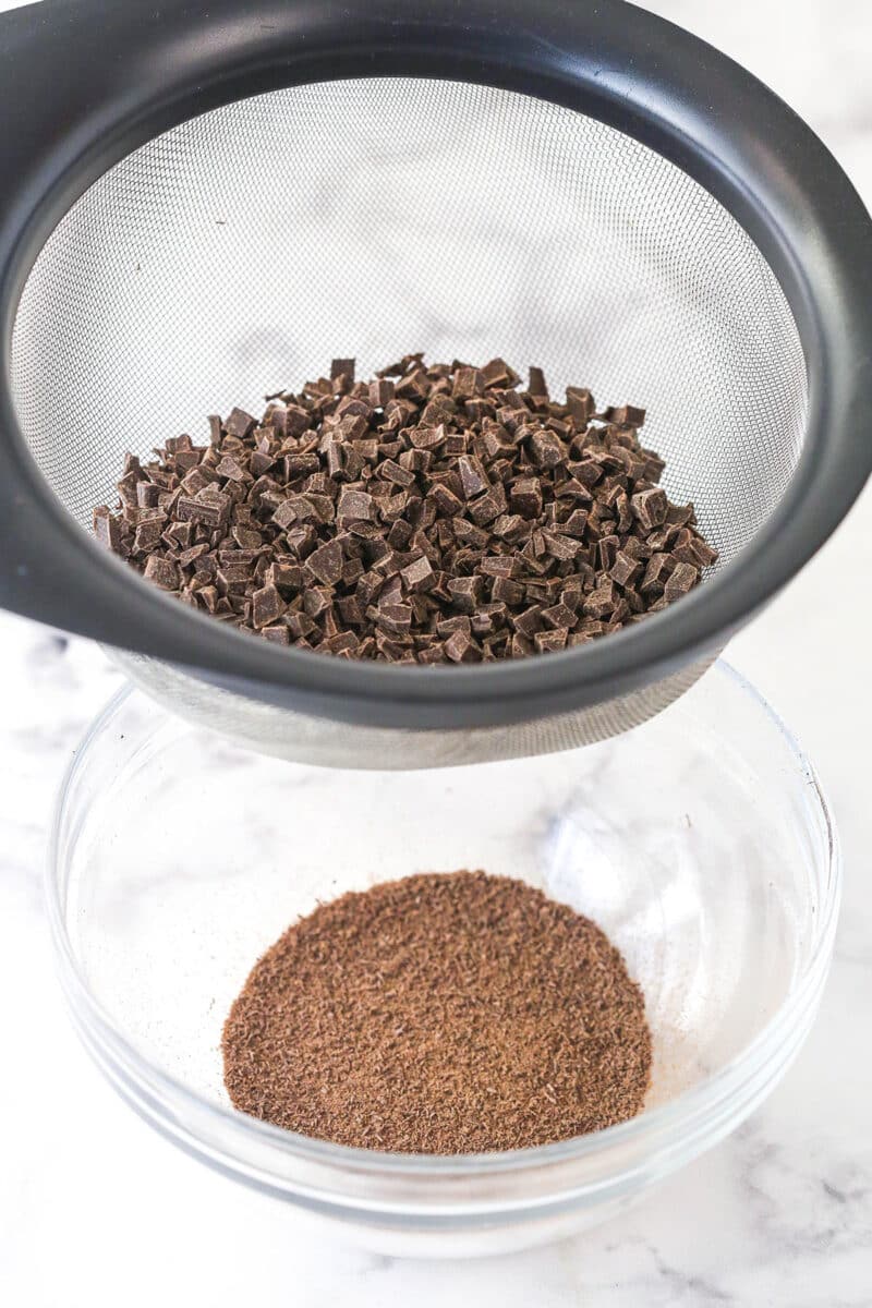 Sifting powder out of chopped chocolate.