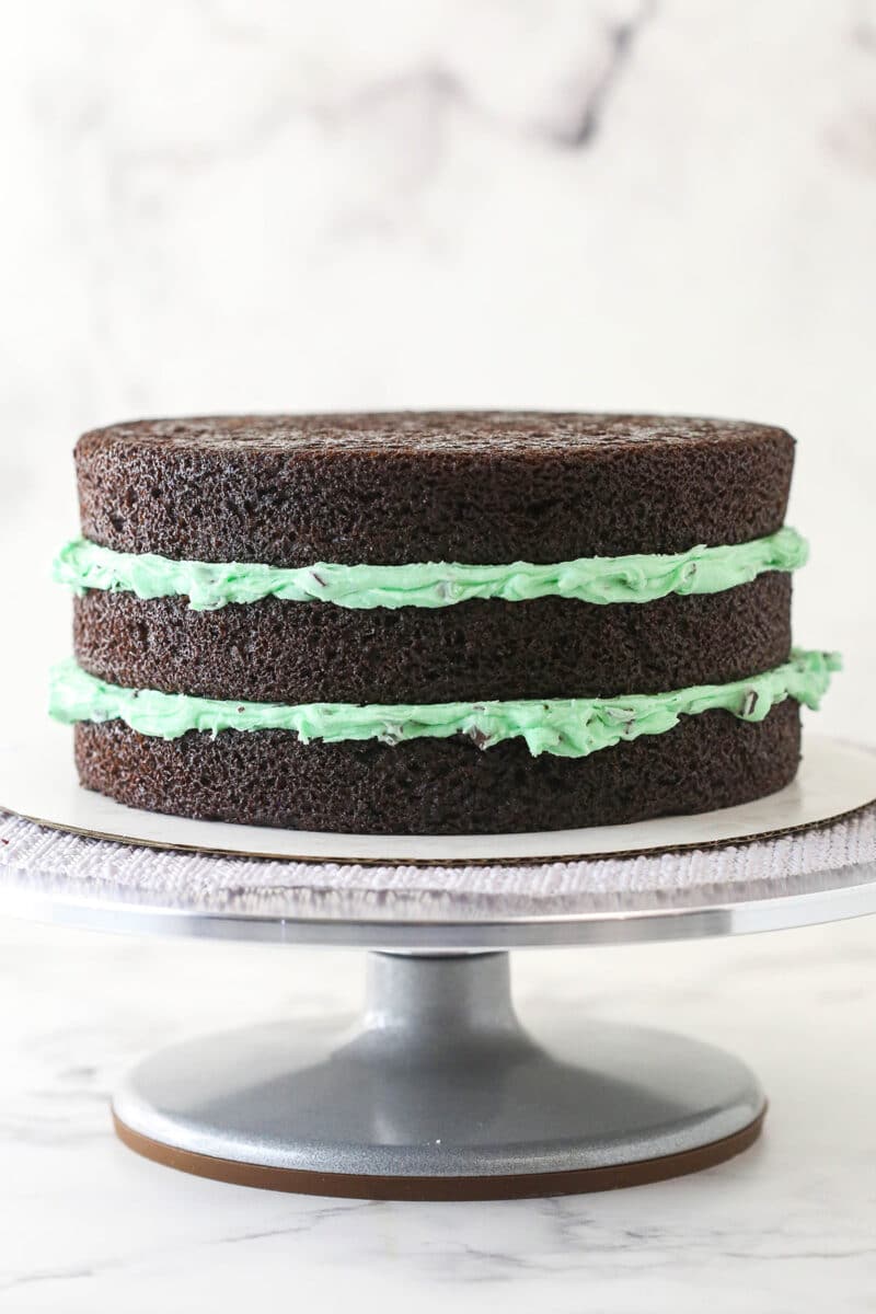 3 layers of chocolate cake divided by mint frosting.