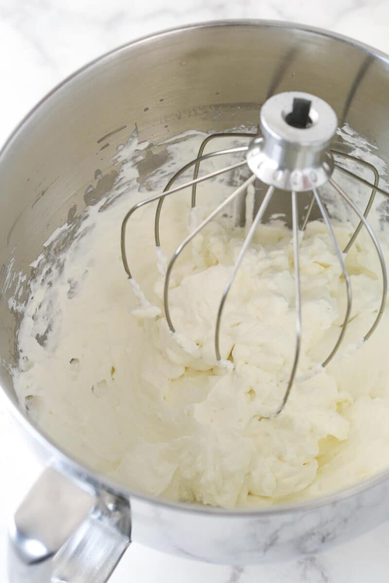 Whipped cream in a mixing bowl.