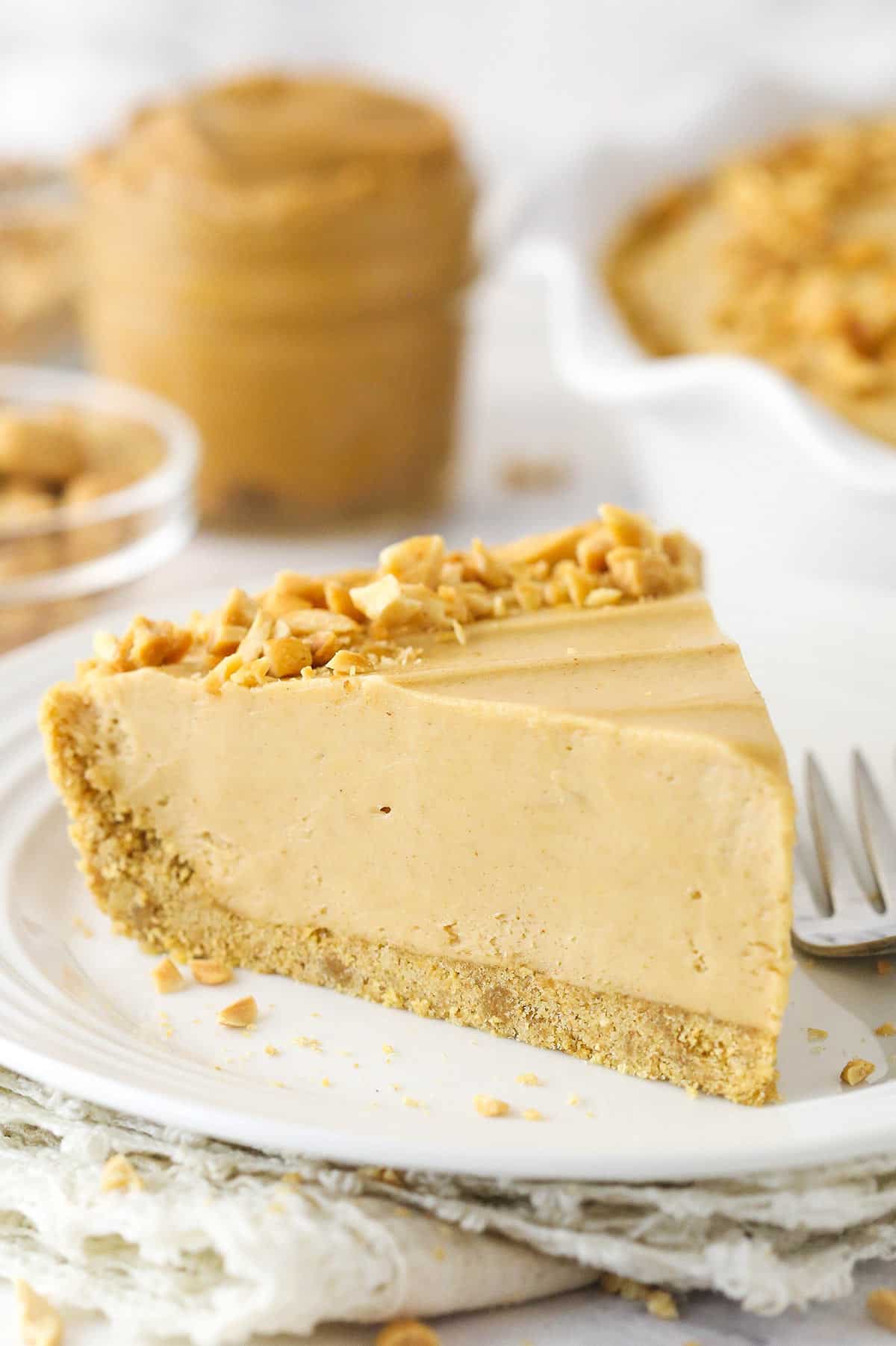 A slice of peanut butter pie on a plate.