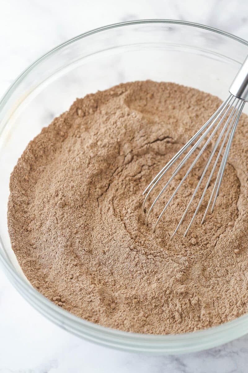 Whisking together the dry ingredients for chocolate cake batter.