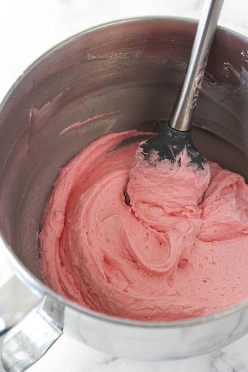 Raspberry buttercream in a mixing bowl.