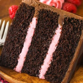 A slice of red wine chocolate cake served on a plate.