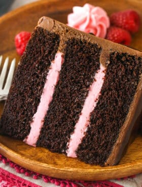 A slice of red wine chocolate cake served on a plate.