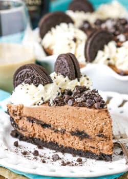 A slice of Baileys Chocolate Cream Pie next to a silver fork on a white plate