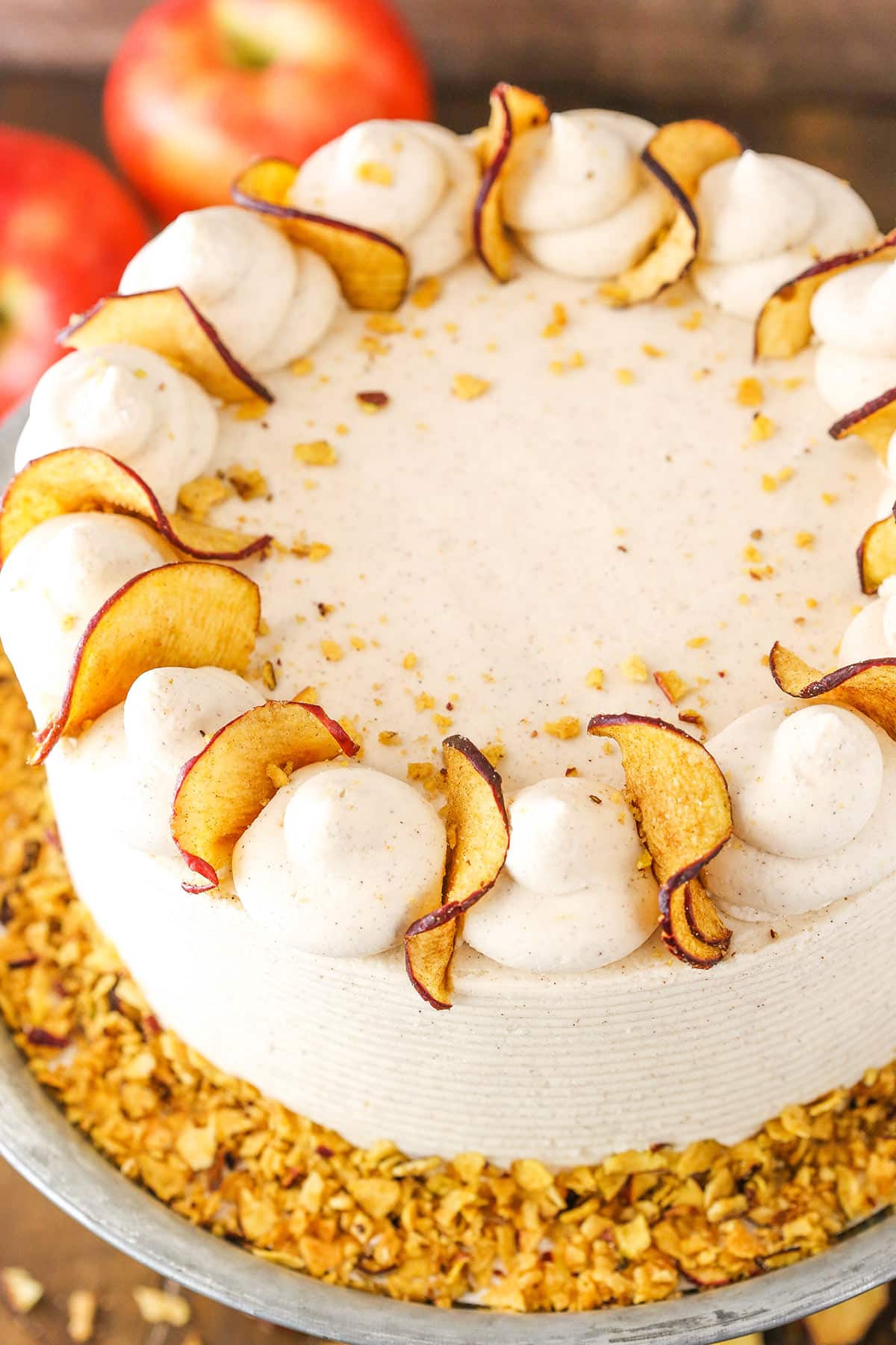 Overhead view of a full Cinnamon Apple Layer Cake on a gray cake stand