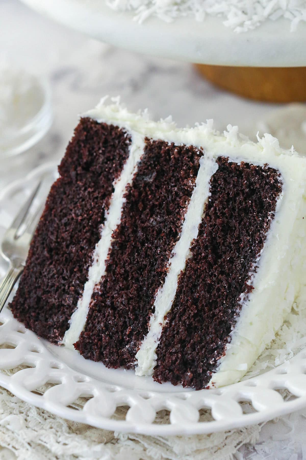 A slice of coconut chocolate cake on a plate.
