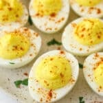 Deviled eggs on a serving plate.