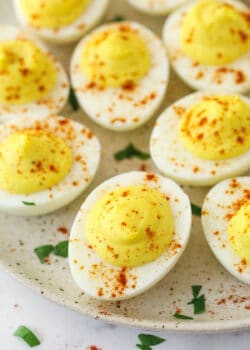 Deviled eggs on a serving plate.