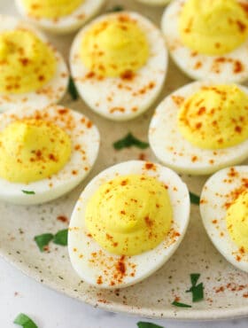 Deviled eggs on a serving plate.