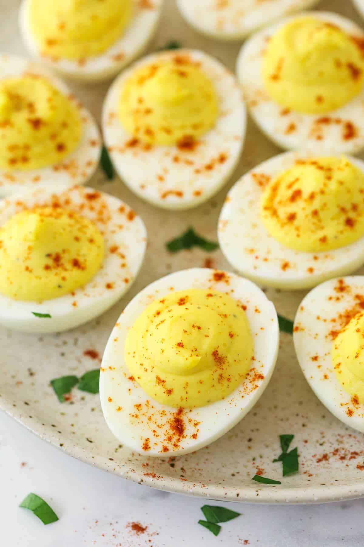 Deviled eggs on a serving plate.