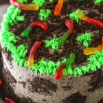 Overhead view of a full Dirt Cake on a gray cake stand