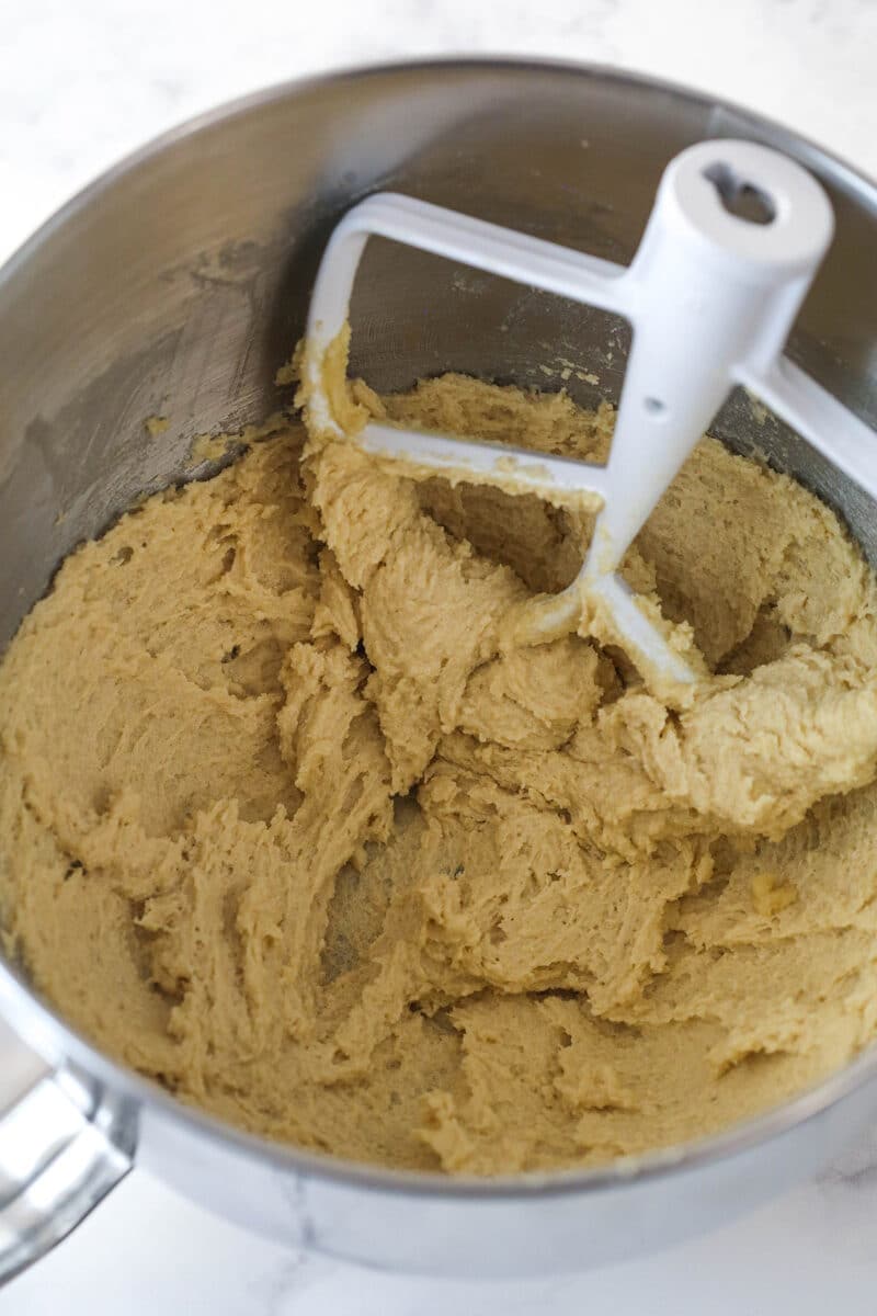 Creaming together butter and sugars for cookie cake batter.