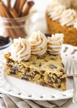 A slice of oatmeal raisin cookie cake on a plate.