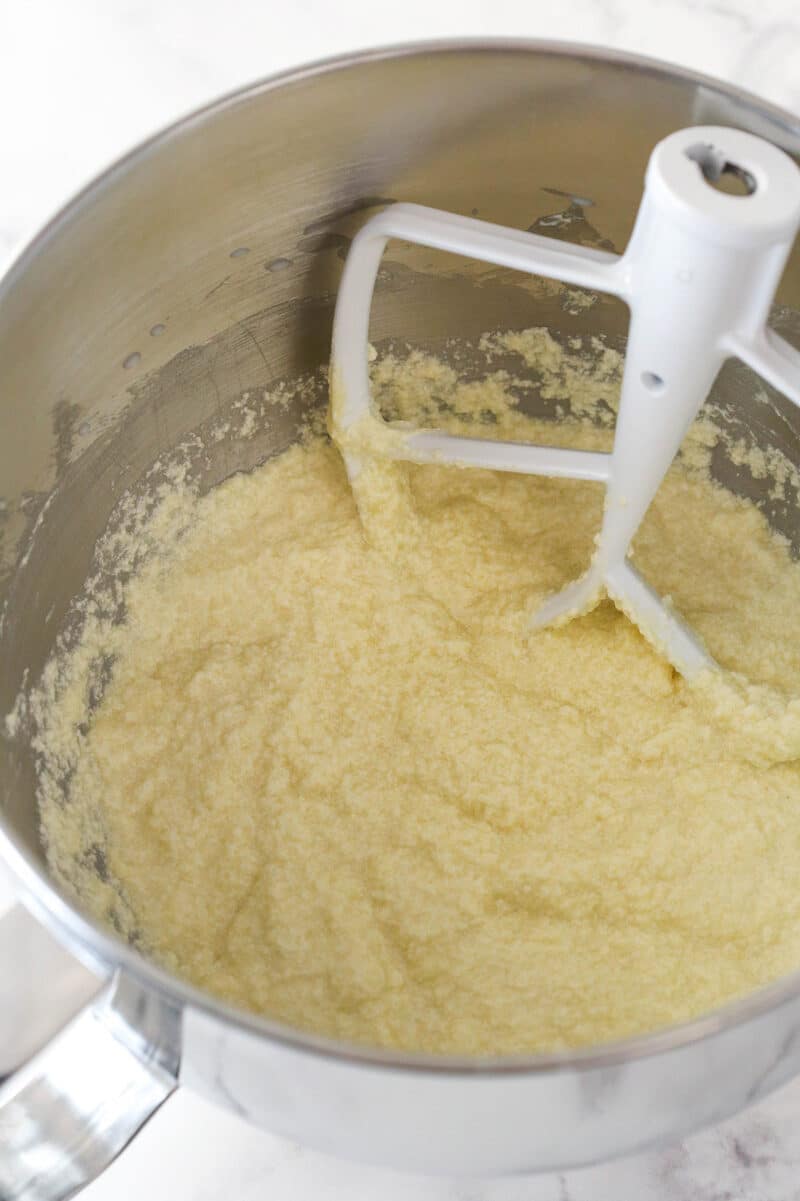 Alternating mixing dry ingredients and milk into cupcake batter.