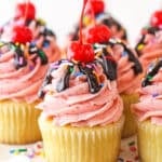 Closeup image of strawberry sundae cupcakes on a serving platter.