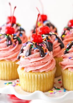 Closeup image of strawberry sundae cupcakes on a serving platter.