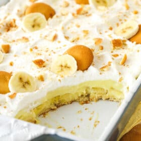Banana pudding with a slice taken out of it.