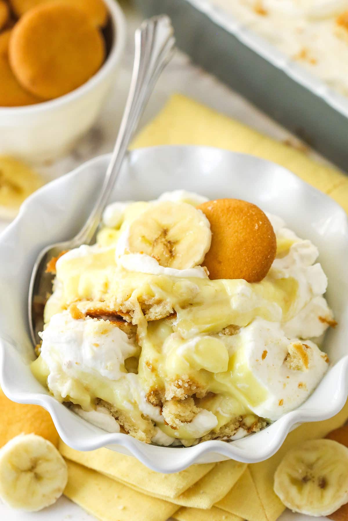 This from-scratch banana pudding is made of layers of vanilla wafers, banana slices, and thick, smooth banana flavor-infused vanilla pudding. Banana pudding in a bowl with a spoon.